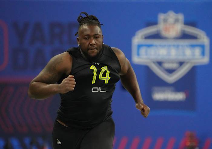 Mar 4, 2022; Indianapolis, IN, USA; North Carolina offensive lineman Joshua Ezeudu (OL14) runs the 40-yard dash during the 2022 NFL Scouting Combine at Lucas Oil Stadium.